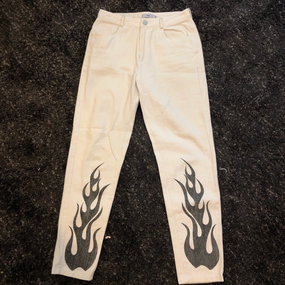 Adika white jeans with black flames on bottom